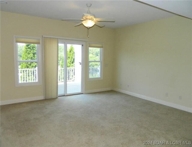 spare room with ceiling fan and carpet floors