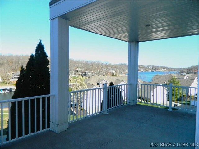 balcony featuring a water view