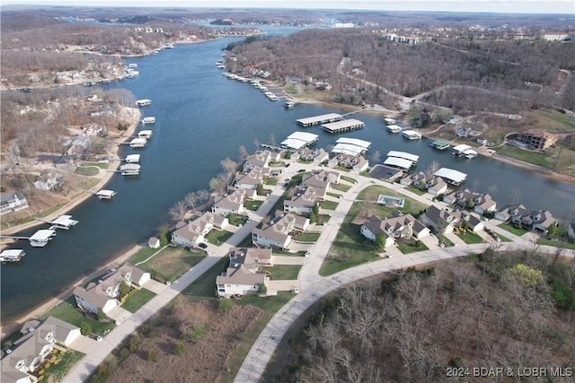 bird's eye view featuring a water view and a residential view