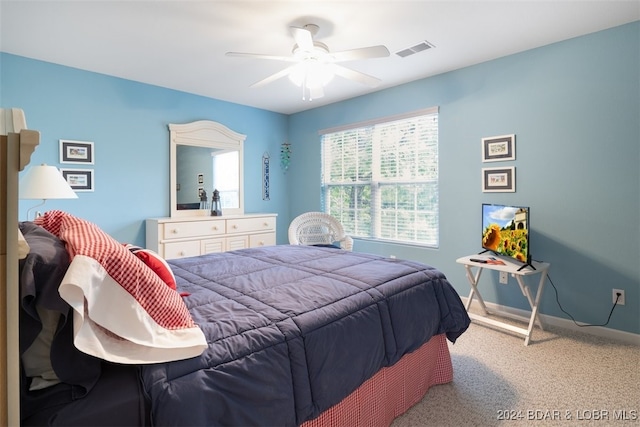 bedroom with ceiling fan and carpet floors