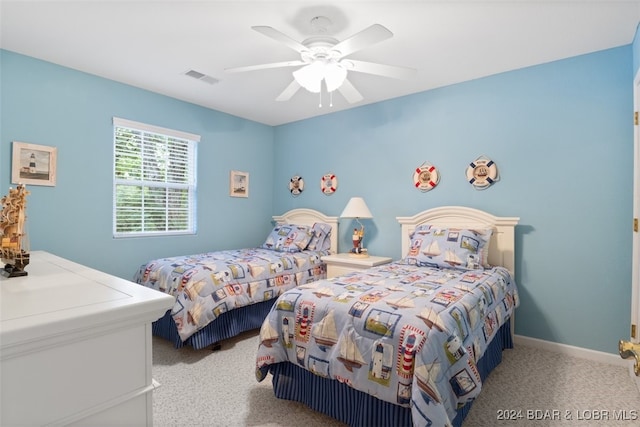 carpeted bedroom with ceiling fan