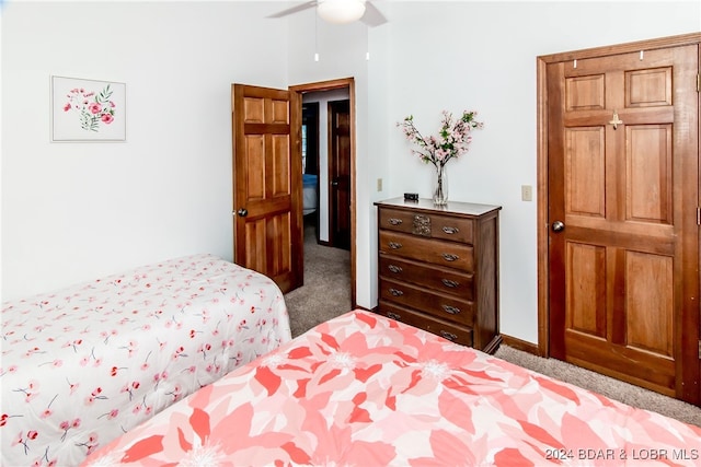 bedroom featuring light colored carpet and ceiling fan