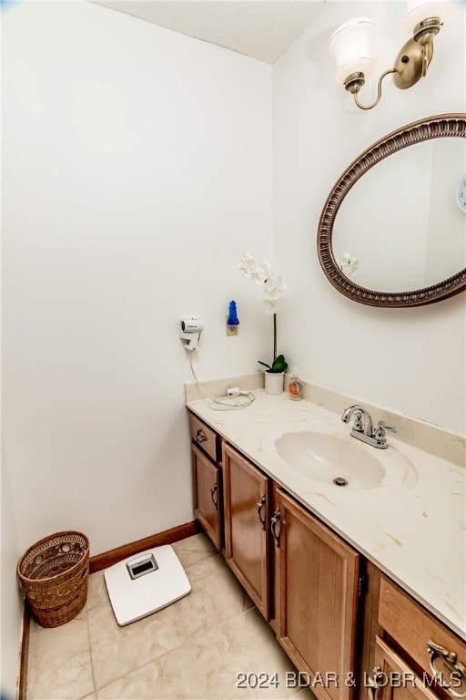 bathroom with tile patterned flooring and vanity