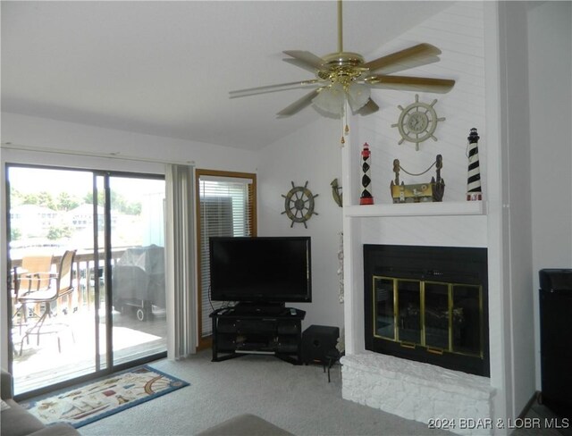 unfurnished living room featuring ceiling fan, carpet, and lofted ceiling