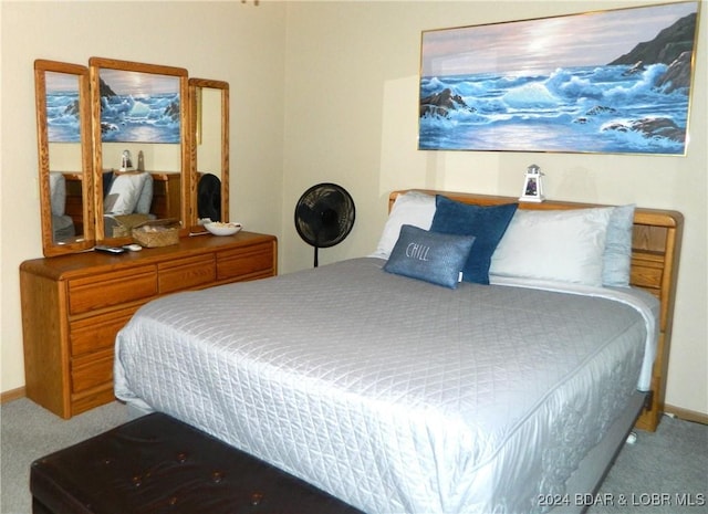 bedroom with carpet flooring and baseboards