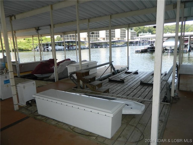 dock area with a water view and boat lift