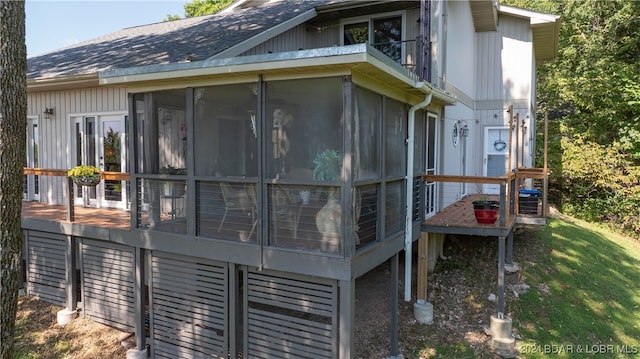 view of side of property with a sunroom