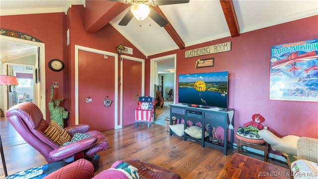 living room featuring vaulted ceiling with beams, dark hardwood / wood-style floors, ceiling fan, and ornamental molding