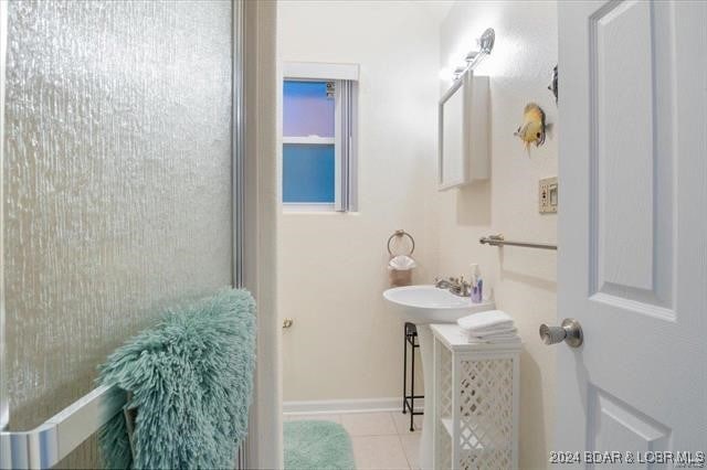 bathroom with tile patterned floors