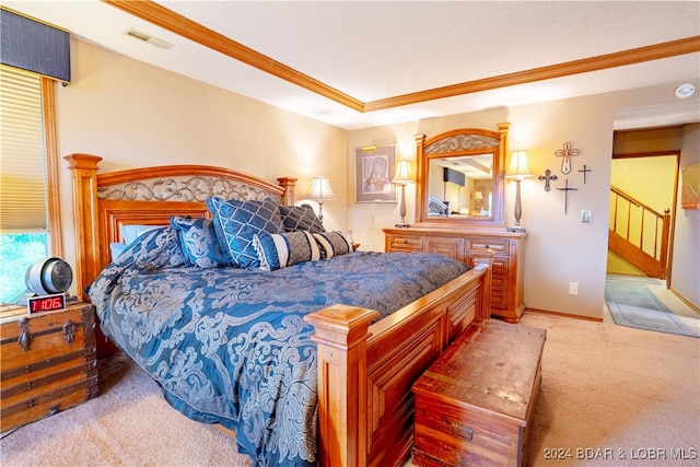 bedroom with light carpet and crown molding