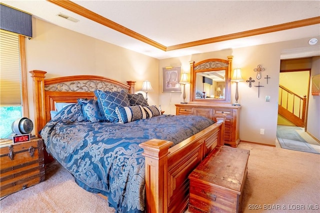 bedroom with carpet floors, ornamental molding, and visible vents