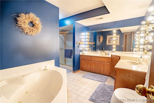 full bath with vanity, tile patterned floors, a stall shower, and a tub with jets