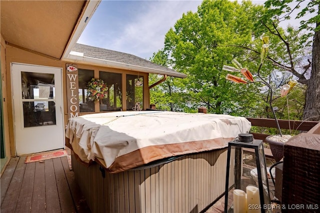 wooden terrace with a hot tub