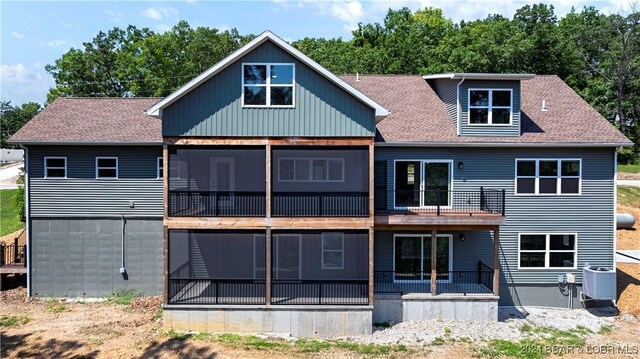 back of house with a balcony and central air condition unit