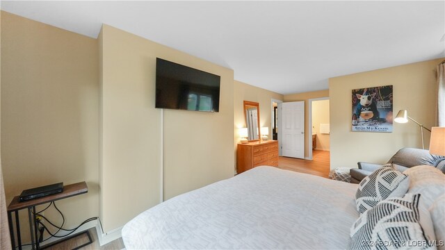 bedroom with light wood-type flooring