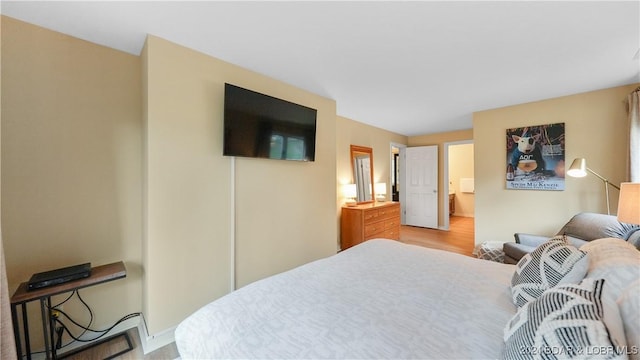 bedroom featuring light wood-style flooring