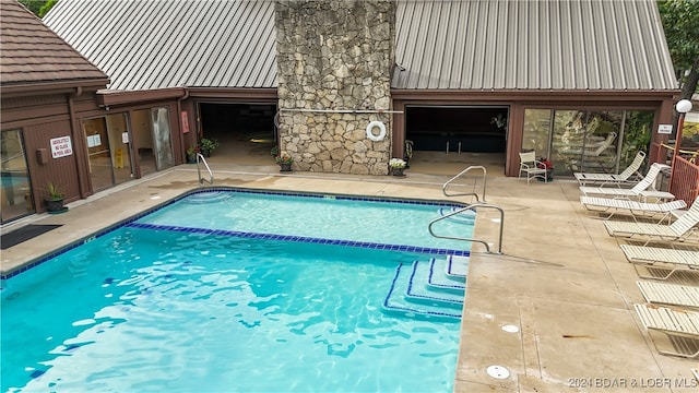 view of pool with a patio