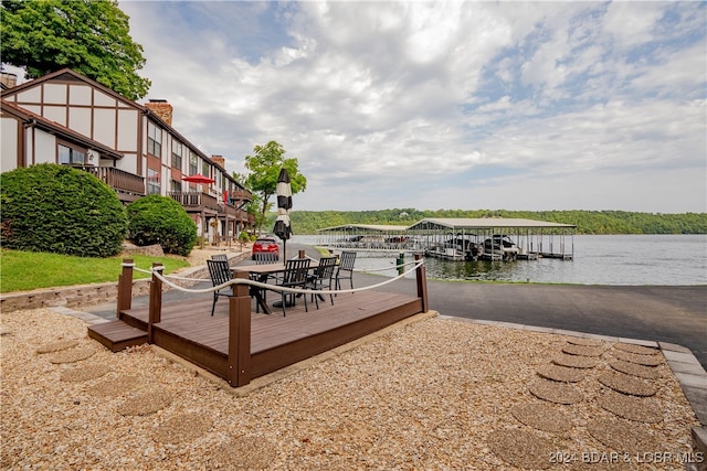 dock area featuring a deck with water view