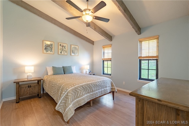 bedroom featuring lofted ceiling with beams, light wood-type flooring, and ceiling fan