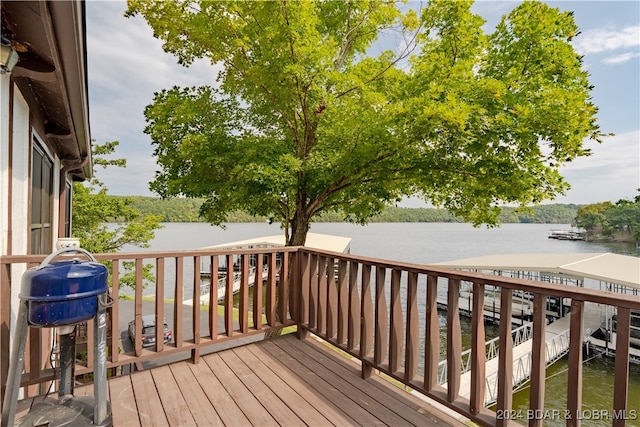 wooden deck featuring a water view