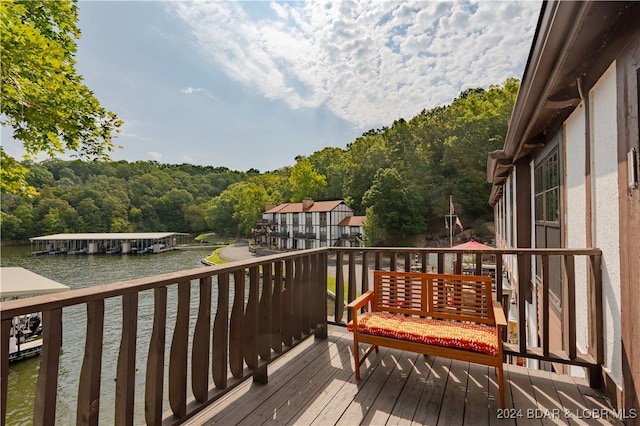 wooden deck with a water view