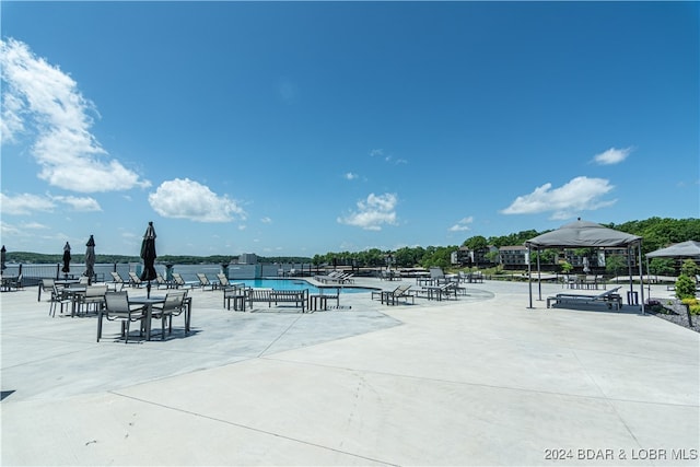 view of home's community with a water view and a gazebo