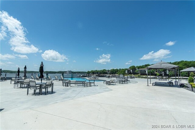 182 Vintage Dr Unit 4A, Lake Ozark, MO 65049 - view of patio / terrace featuring fence and a community pool