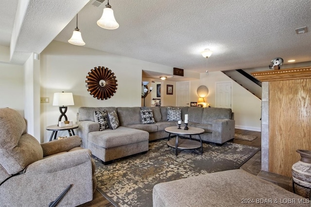 living room featuring a textured ceiling