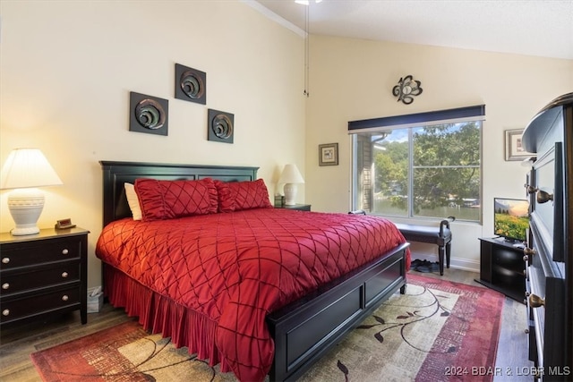 bedroom featuring lofted ceiling and wood-type flooring