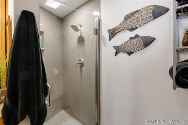 bathroom with a shower stall