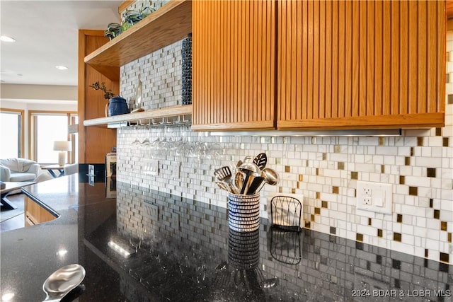 interior details with tasteful backsplash, open shelves, and recessed lighting