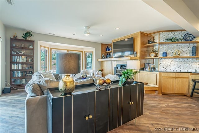 living room featuring visible vents, a ceiling fan, wood finished floors, and recessed lighting