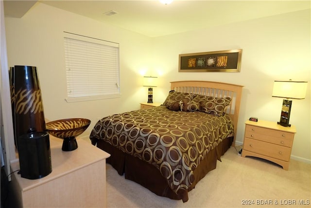 bedroom with light carpet and visible vents