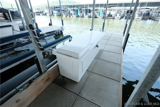 view of dock with a water view and boat lift