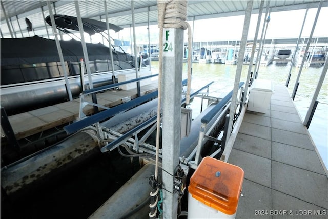 view of dock featuring a water view and boat lift