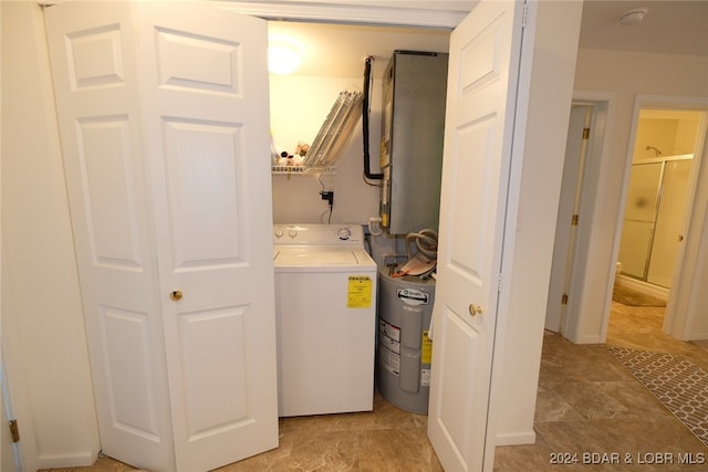 washroom with washer / clothes dryer and water heater