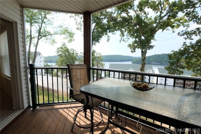 balcony featuring a water view