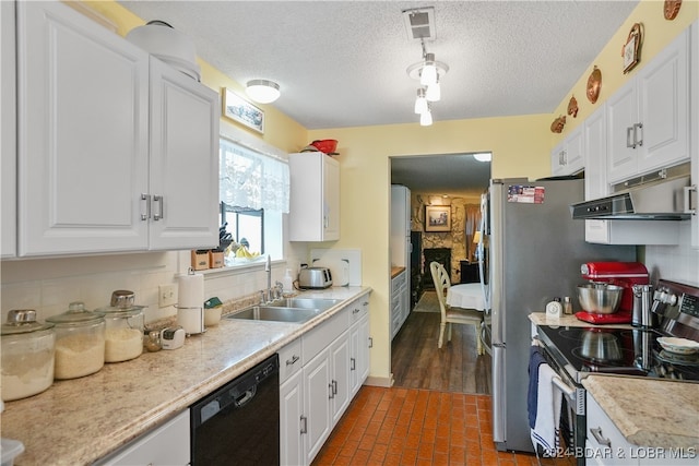 kitchen with stainless steel range with electric stovetop, sink, white cabinetry, and dishwasher