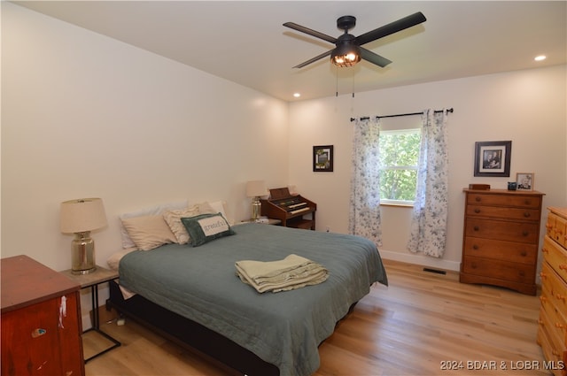 bedroom featuring ceiling fan and light wood-type flooring