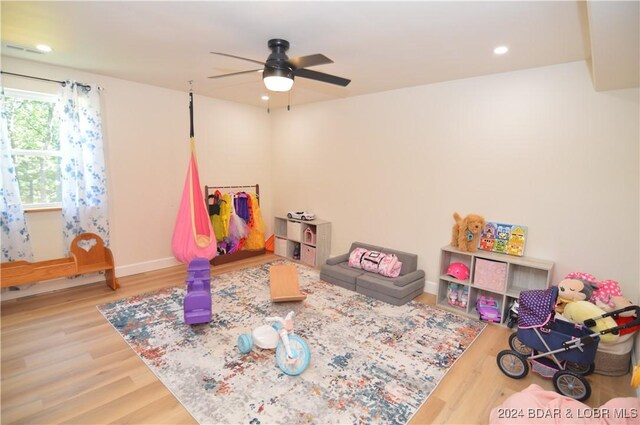 recreation room featuring wood-type flooring and ceiling fan