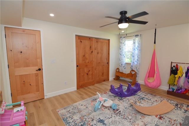 rec room featuring hardwood / wood-style flooring and ceiling fan