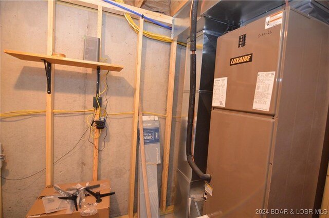 utility room with heating unit