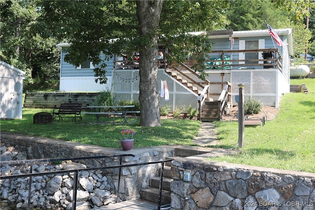 view of yard with a wooden deck