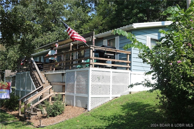 view of side of property featuring a deck