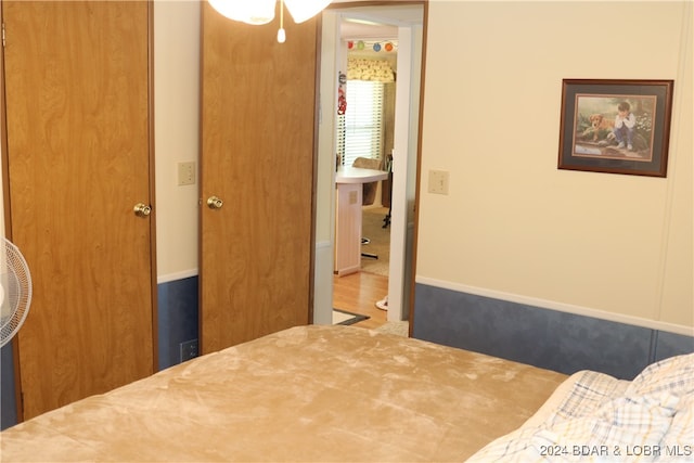 bedroom with hardwood / wood-style floors