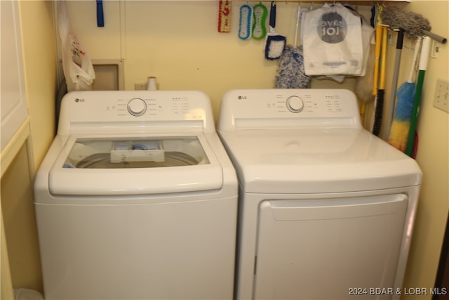 laundry area with washing machine and dryer