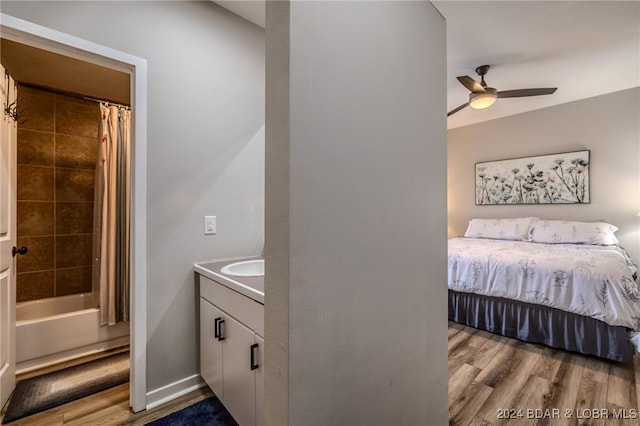 bedroom featuring light wood-type flooring and ceiling fan