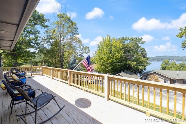 wooden terrace with a water view