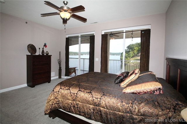 bedroom with multiple windows, access to exterior, ceiling fan, and carpet