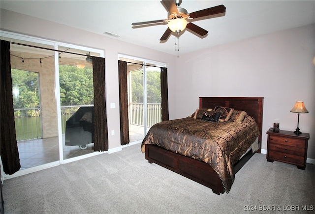 carpeted bedroom with access to exterior and ceiling fan